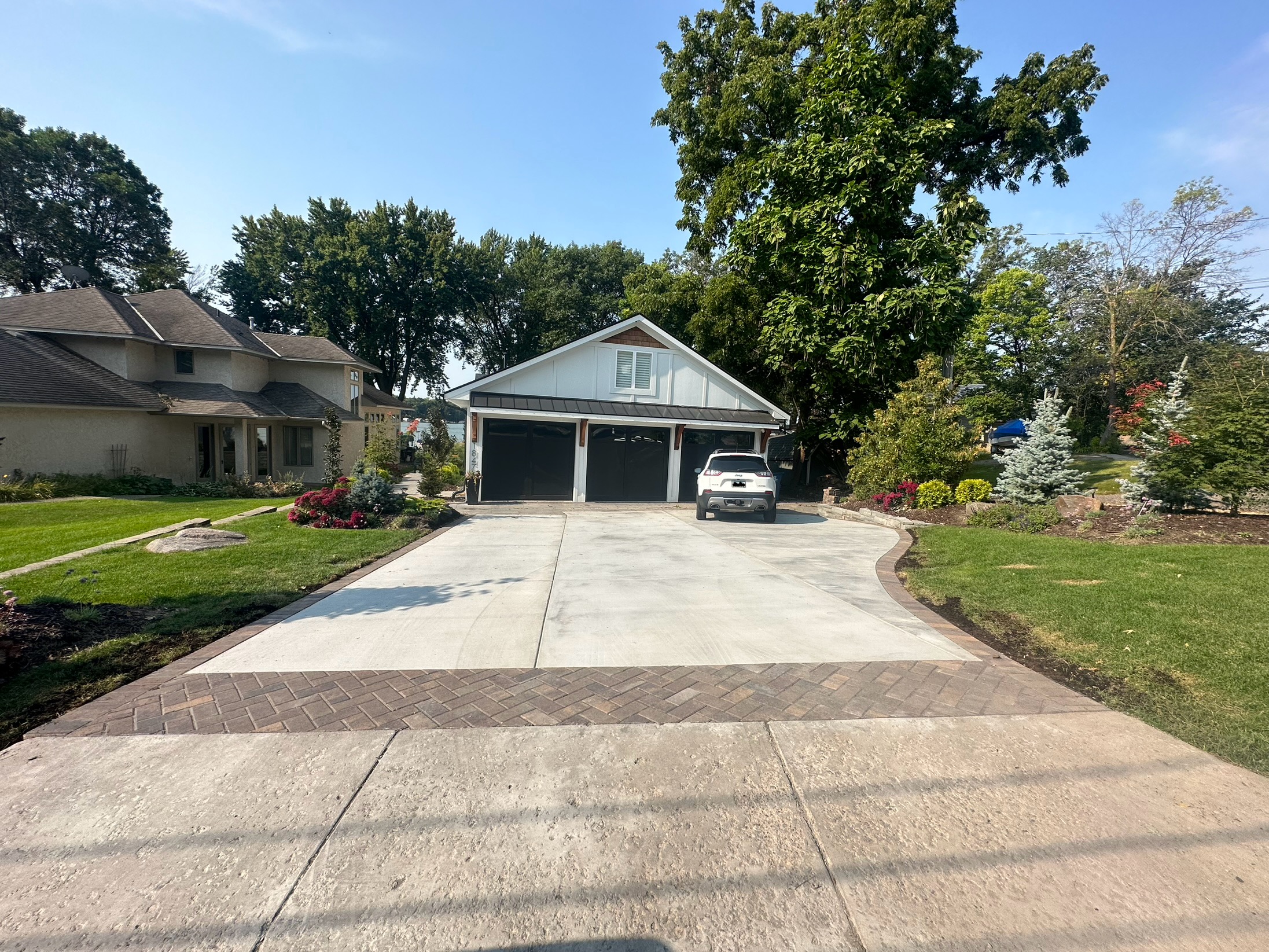 Finished concrete driveway with paver border