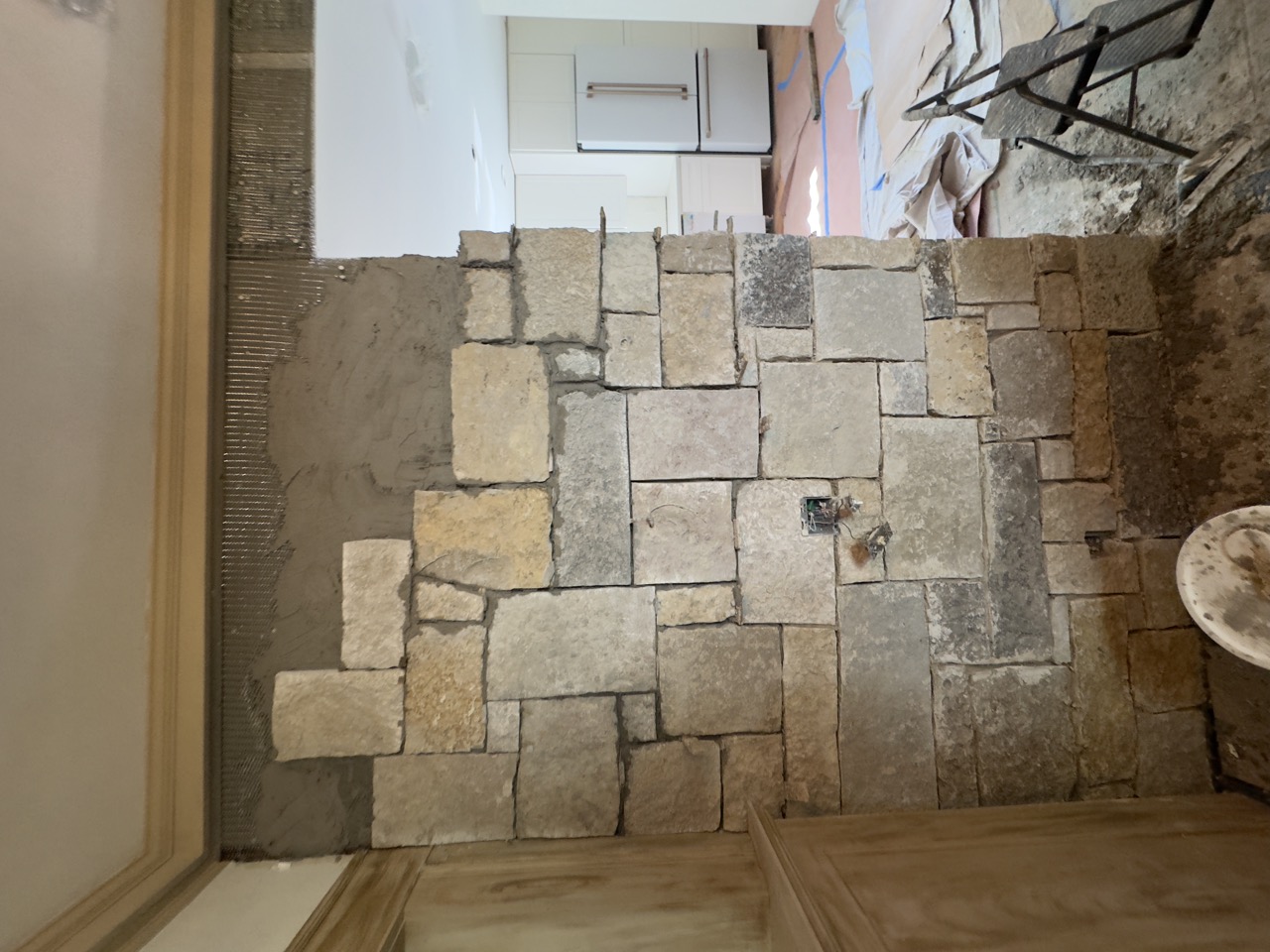 Masonry stone installation in progress