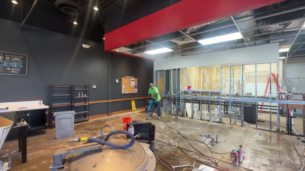 Restaurant tenant fitup in progress — framing and painting